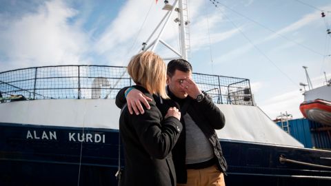 Abdullah Kurdi and his sister Tima embrace in front of a rescue ship named after his son Alan Kurdi at its inauguration 2019 in Palma de Mallorca, Spain.