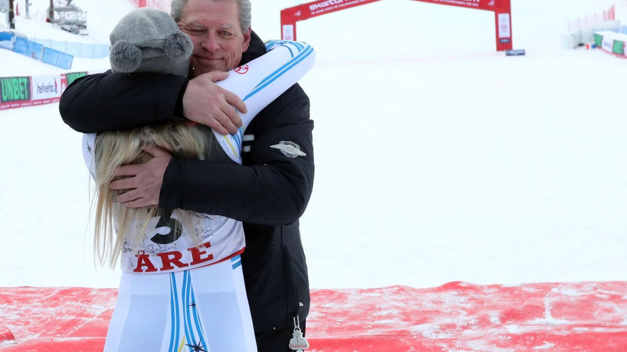Vonn hugs her father at the finish line.