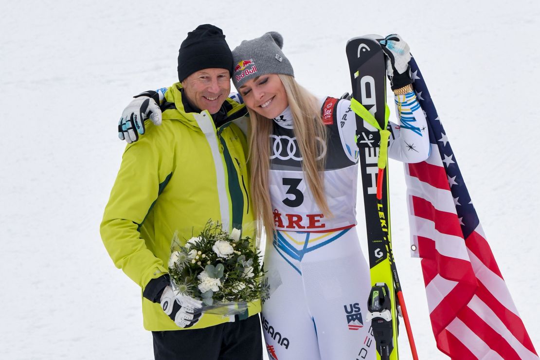 Vonn with Stenmark during the flowers ceremony after the women's downhill.