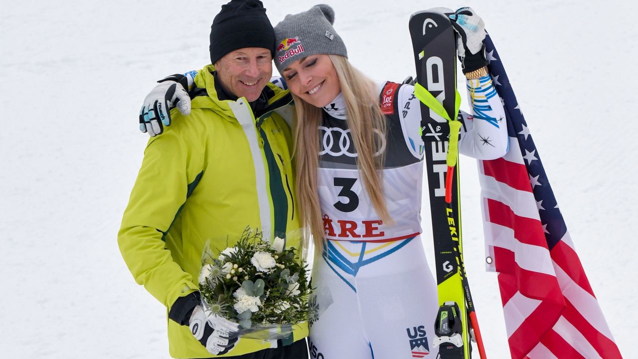 Vonn with Stenmark during the flowers ceremony after the women's downhill.