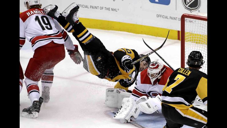 Pittsburgh's Garrett Wilson is upended during an NHL game against Carolina on Tuesday, February 5.