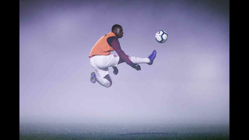 Arsenal's Jordi Osei-Tutu warms up in foggy conditions ahead of a Premier League 2 match in Borehamwood, England, on Monday, February 4.