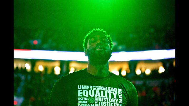 Miami guard Dwayne Wade listens to the National Anthem before an NBA game in Portland, Oregon, on Tuesday, February 5.