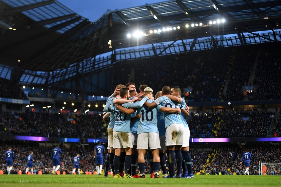 Manchester City players celebrate as they go five goals up against Chelsea.
