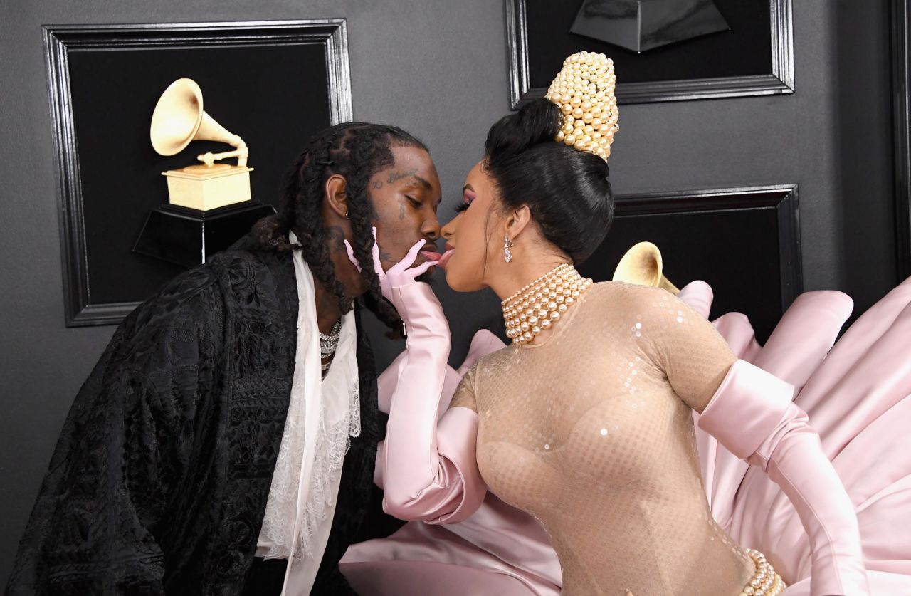 Cardi B and Offset kiss on the Grammys red carpet on Sunday, February 10.