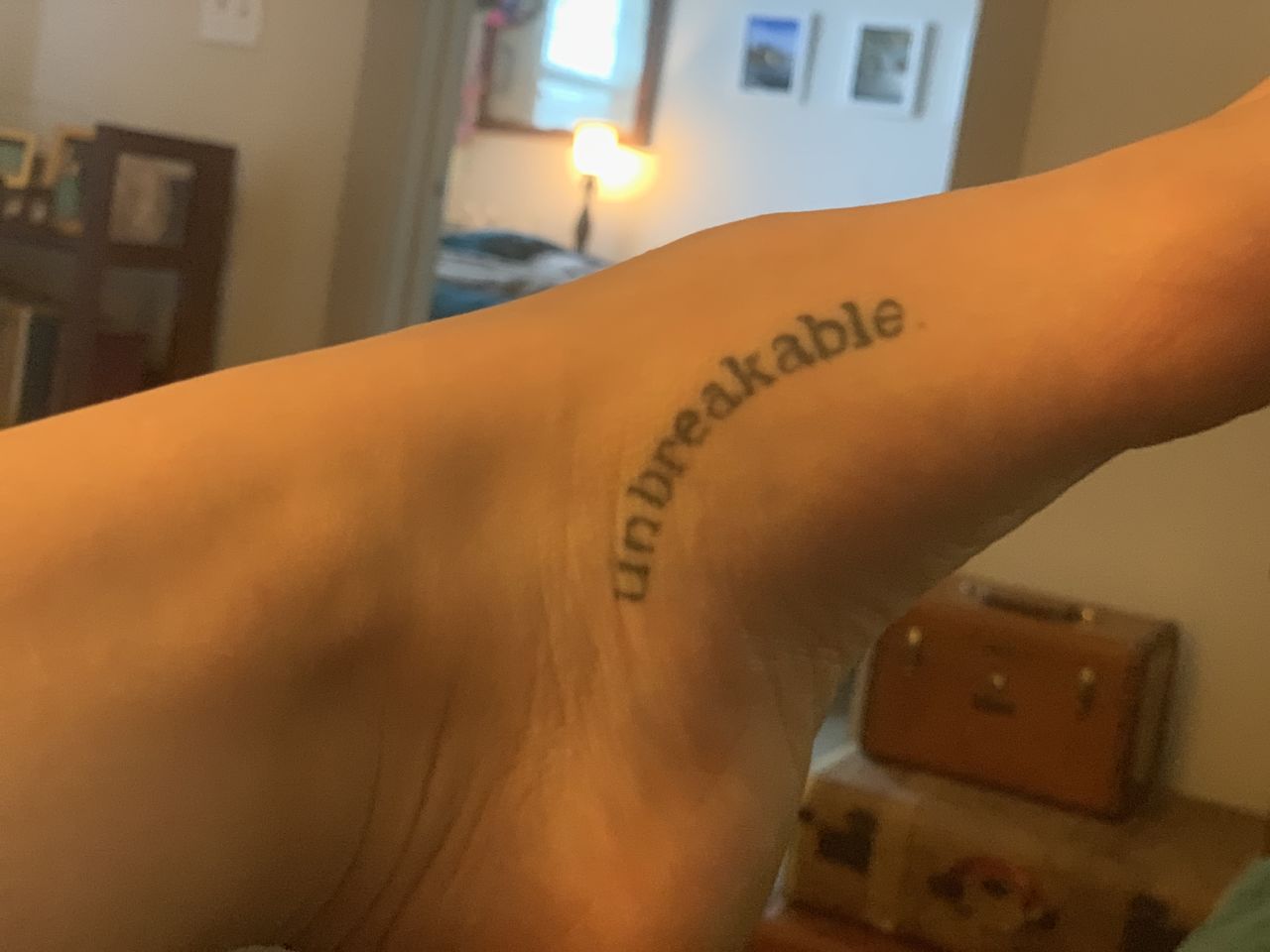 Olivia Adamson, 24, has multiple tattoos. The "unbreakable" tattoo pictured here symbolizes her overcoming sexual assault. "It was exciting and powerful because they had so much meaning behind them," she said. Getting a tattoo, for her, is like a therapy session that is always with her.
