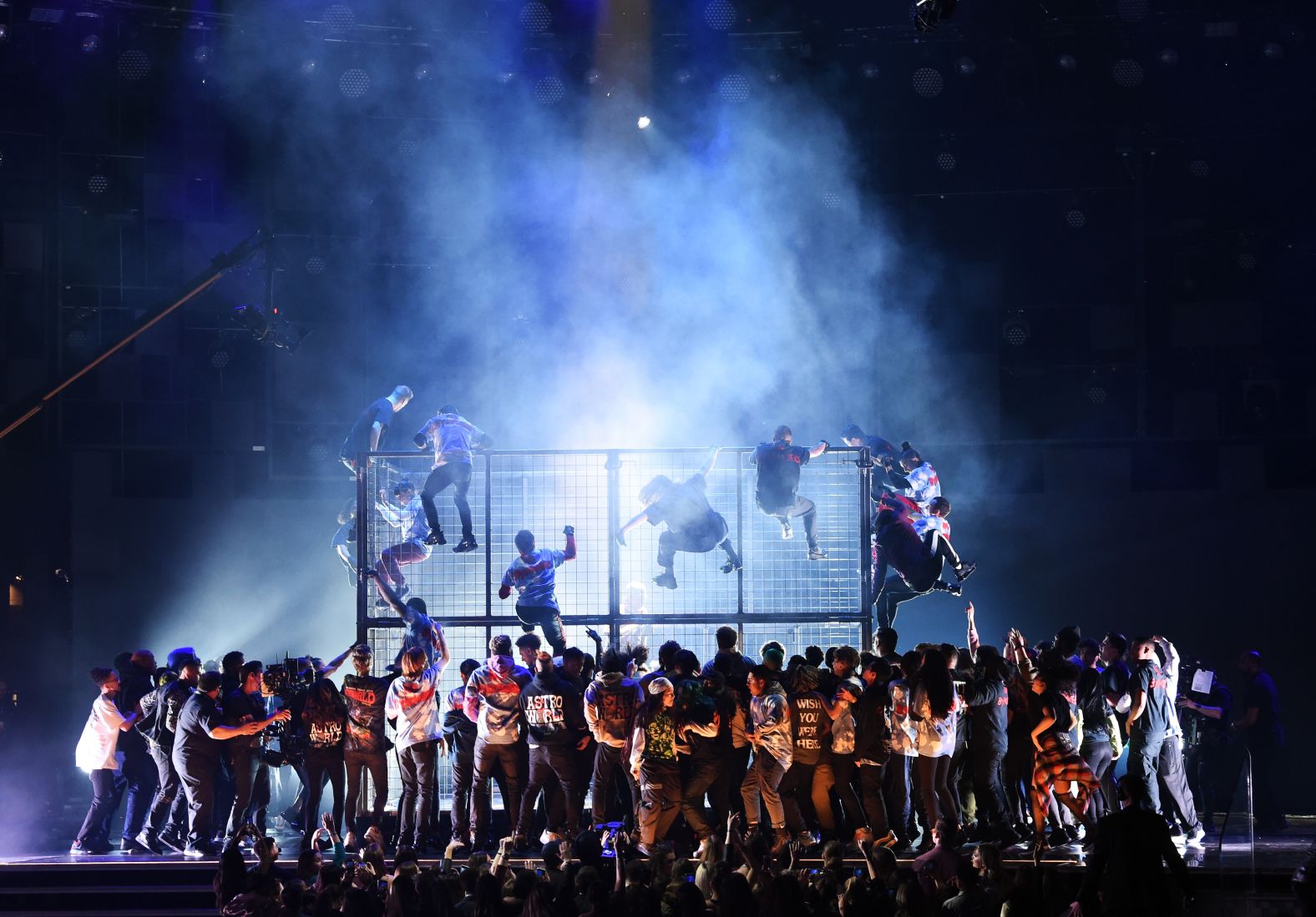 Performers climb a cage that Travis Scott <a href="https://www.cnn.com/entertainment/live-news/grammys-2019/h_10c433737897cbc453a9562e79823b17" target="_blank">was rapping behind.</a>