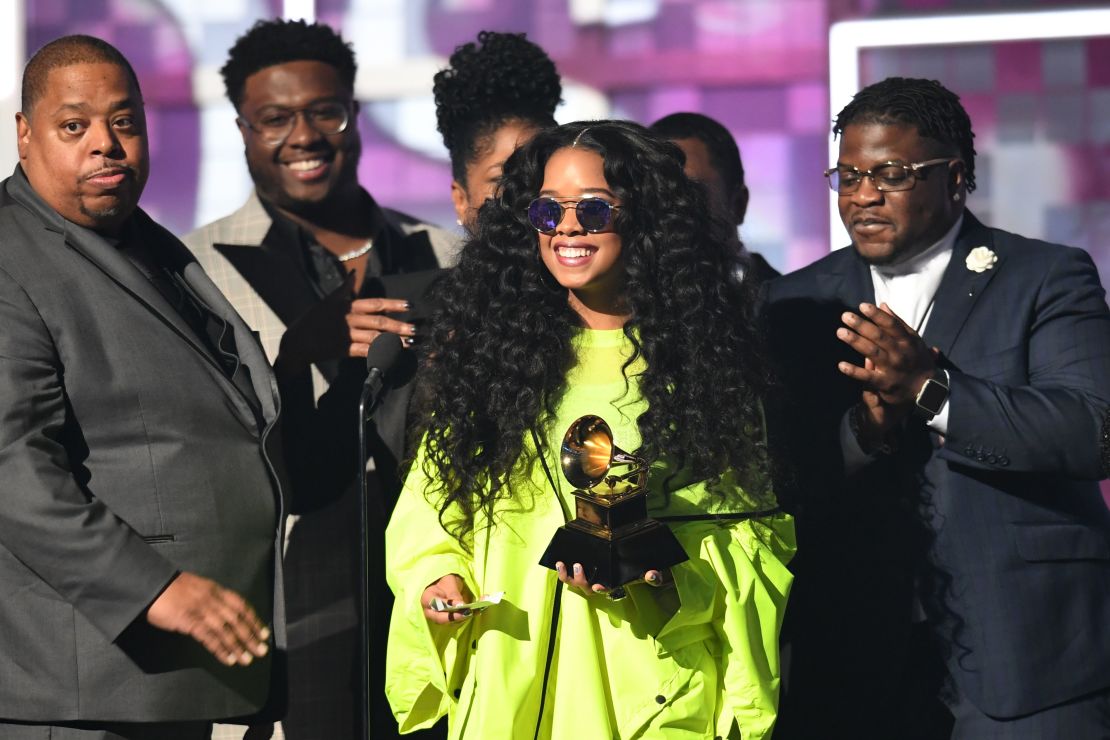 Gabriella Wilson (center), aka H.E.R., accepts the award for Best R&B Album during the 61st Annual Grammy Awards in Los Angeles, February 10, 2019. 