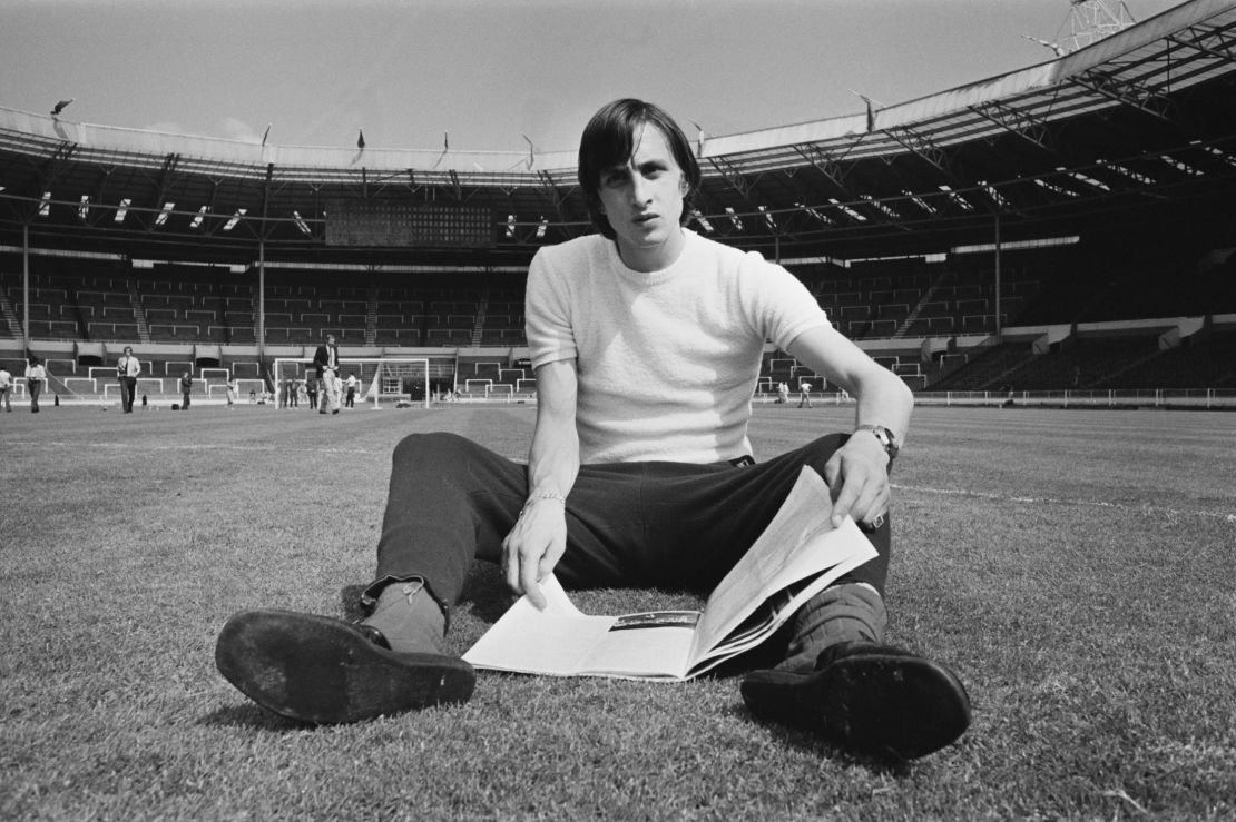Johan Cruyff sits on the Wembley pitch before Ajax's 1971 European Cup final against Panathinaikos - the first of three consecutive titles for the Dutch club.