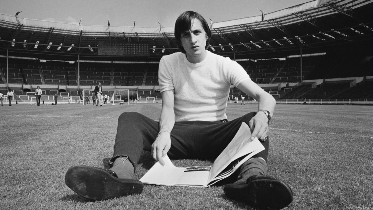 Johan Cruyff sits on the Wembley pitch before Ajax's 1971 European Cup final against Panathinaikos - the first of three consecutive titles for the Dutch club.