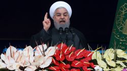 Iranian President Hassan Rouhani speaks during a ceremony celebrating the 40th anniversary of the Islamic Revolution, at the Azadi, Freedom, Square in Tehran, Iran, Monday, Feb. 11, 2019. Speaking from a podium in central Tehran, Rouhani addressed the crowds for nearly 45 minutes, lashing out at Iran's enemies - America and Israel - and claiming that their efforts to "bring down" Iranians through sanctions will not succeed. (AP Photo/Vahid Salemi)