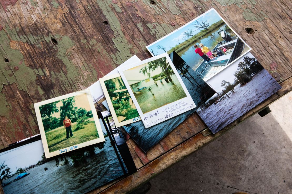 Chris Brunet's family photos show scenes of past life on Isle de Jean Charles, including when homes were flooded.