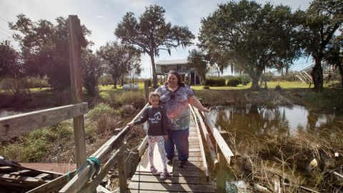 Chantel Comardelle, here with her daughter, says her grandmother is refusing to leave the island.