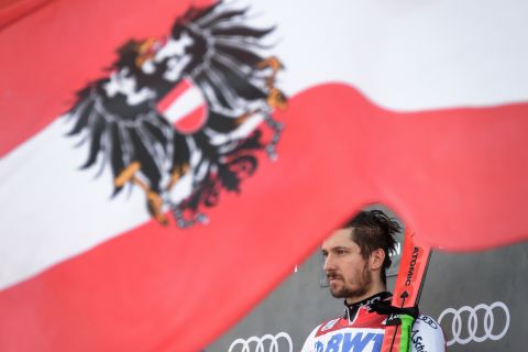 Austria's Marcel Hirscher is presented as the winner of the giant slalom race in Adelboden.