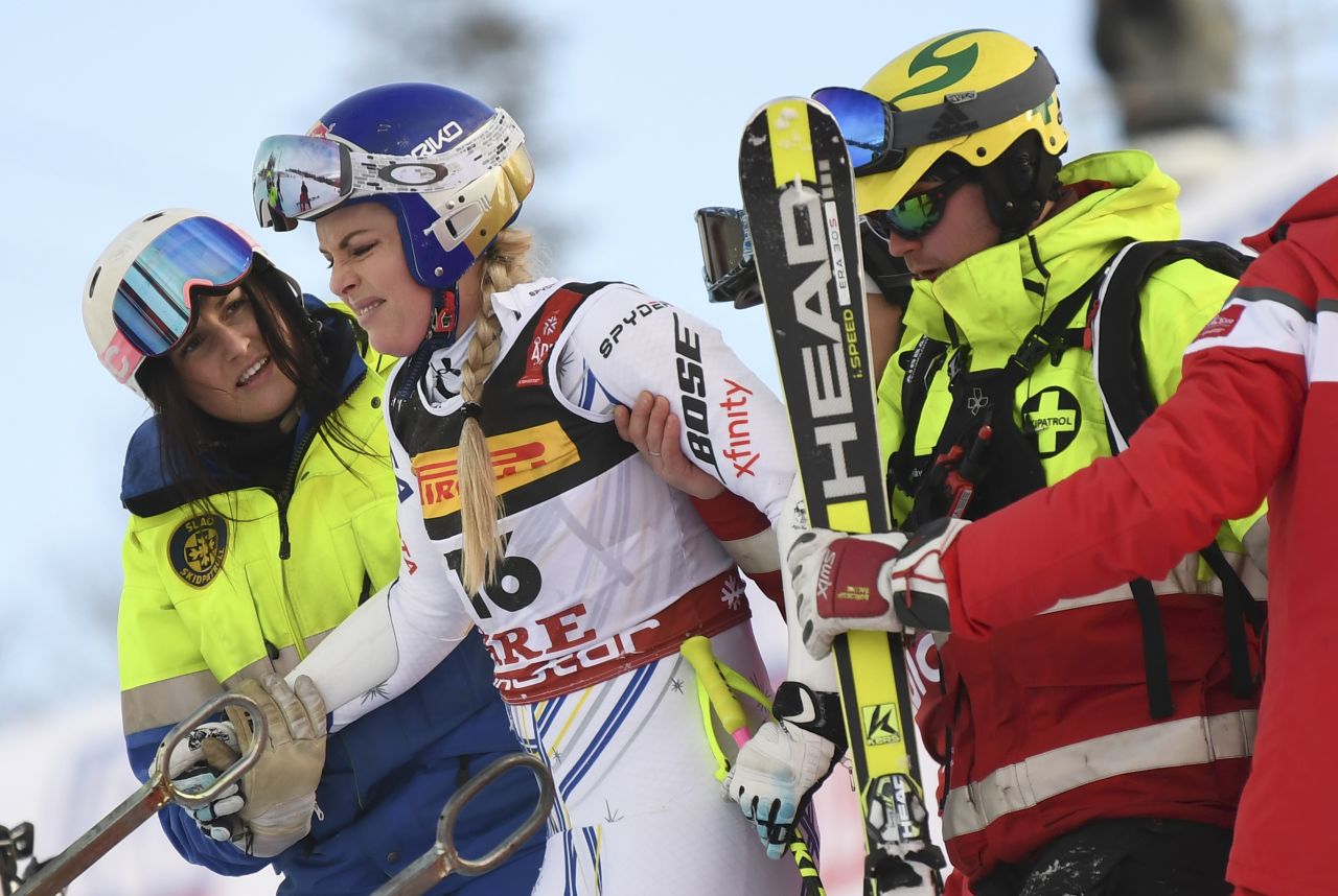 Lindsey Vonn is helped after crashing out of the penultimate race of her career in the super-G event at the World Championships in Are.