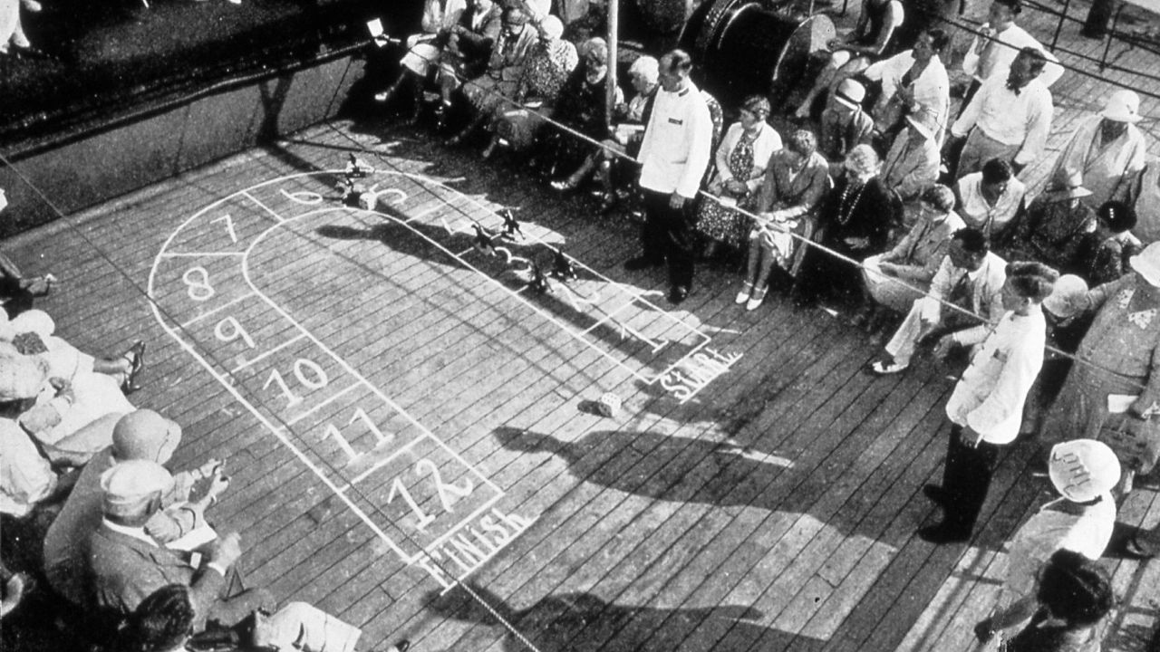 On board the Berengaria in the 1930s, passengers eagerly await the advent of video games.