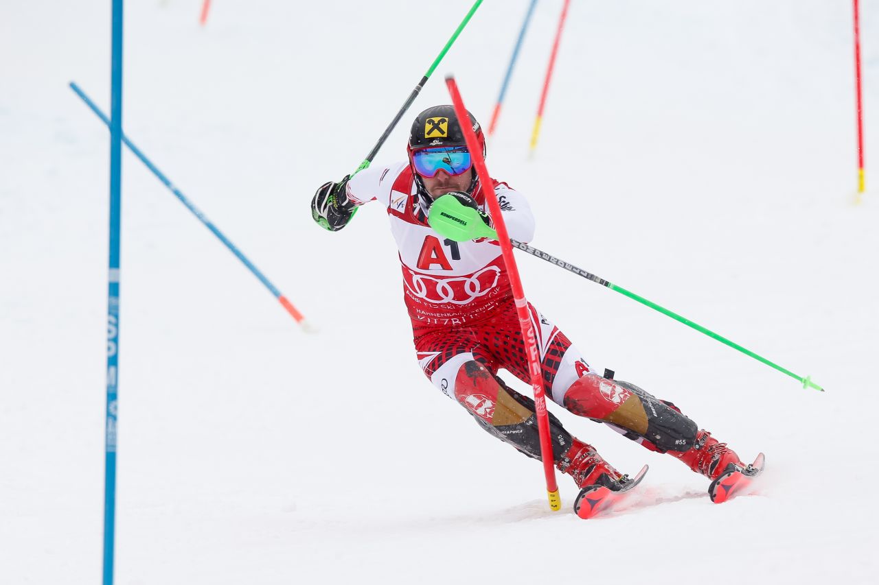 Marcel Hirscher focuses as he slides past the poles during the slalom.
