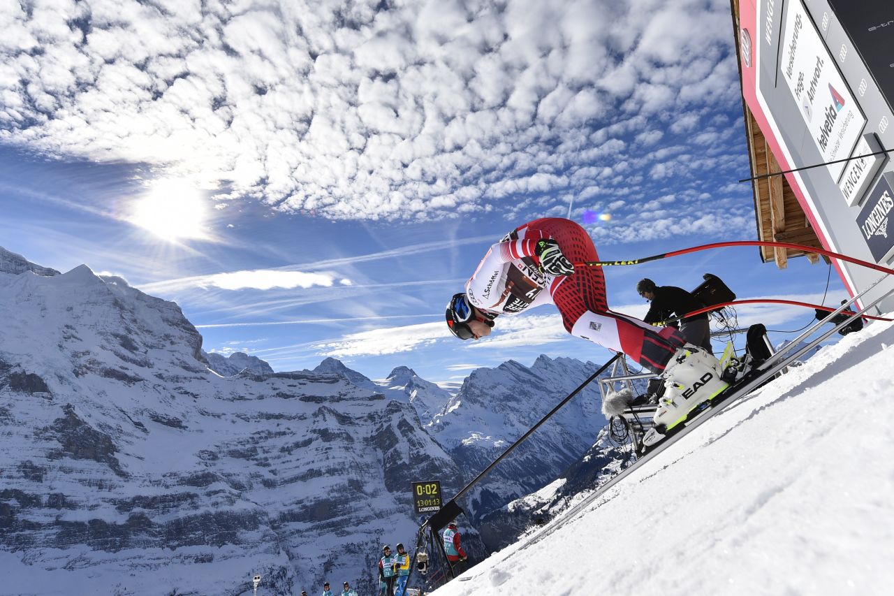 Matthias Mayer steadies himself before beginning his downhill, with the clouds above him mirroring the Wengen mountains.