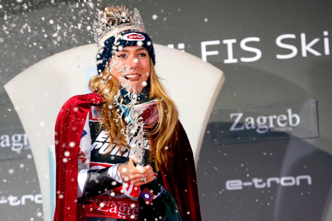 Mikaela Shiffrin celebrates with champagne and a crown after winning the women's slalom in Zagreb.