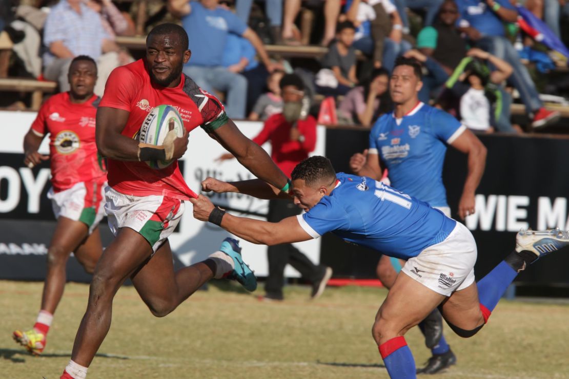 Kenya wing William Ambaka breaks past Namibia fly half Cliven Loubser during the Rugby World Cup qualifier between Namibia and Kenya.