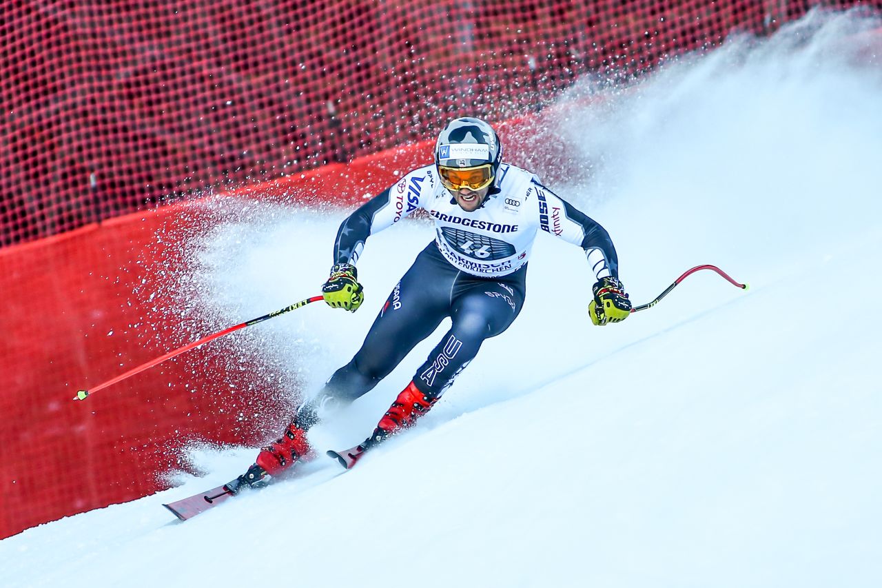 US skier Thomas Biesemeyer leaves a spray of snow behind him as he cuts inside.