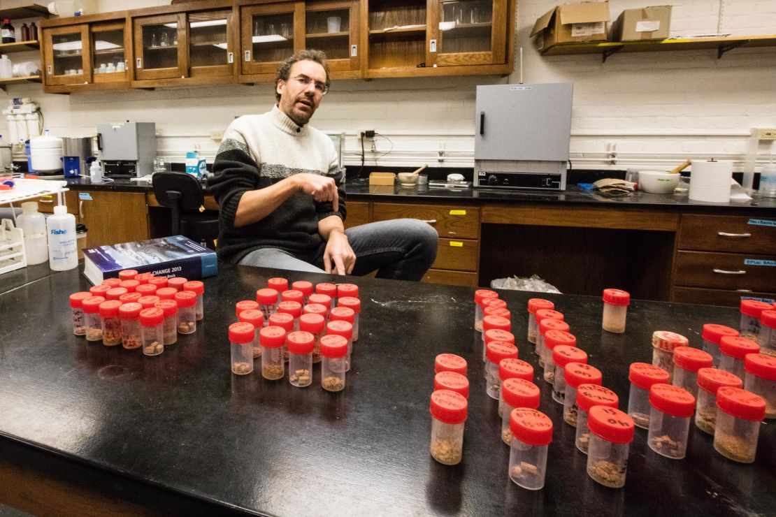 Tor Tornqvist studies climate change, here with soil samples used to assess how fast neighborhoods are sinking.