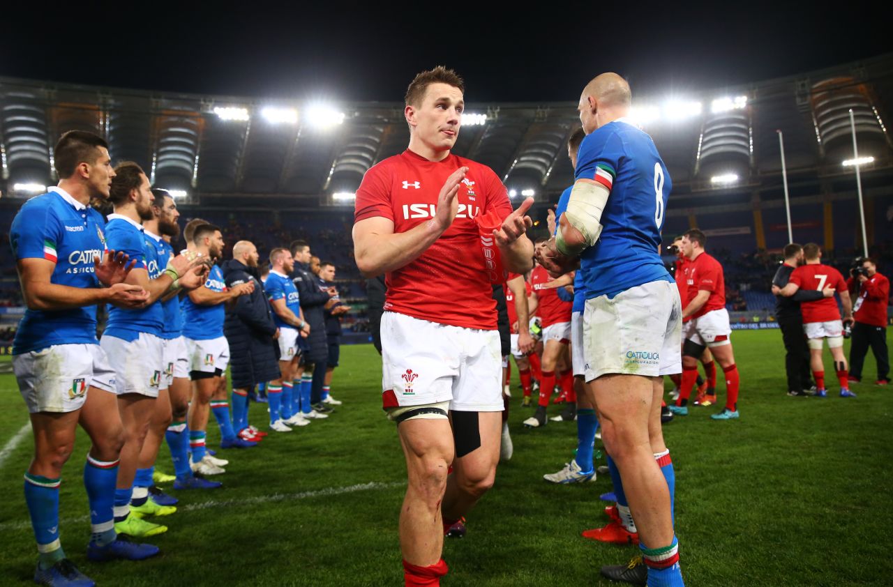 Jonathan Davies captained Wales for the first time in Rome where his side saw off Italy with tries from Josh Adams and Owen Watkin. 