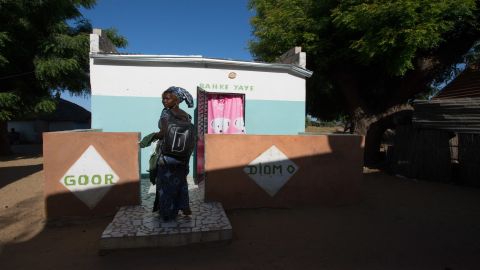 Marie Diouf outside her home in the village of Ndiemou, which means "Salt" in the local Serer language.