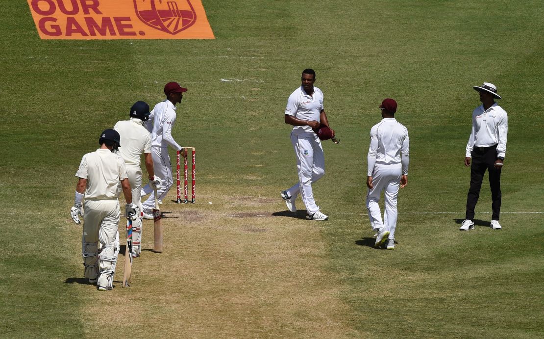 Shannon Gabriel of the West Indies exchanges words with Joe Root and Joe Denly of England.