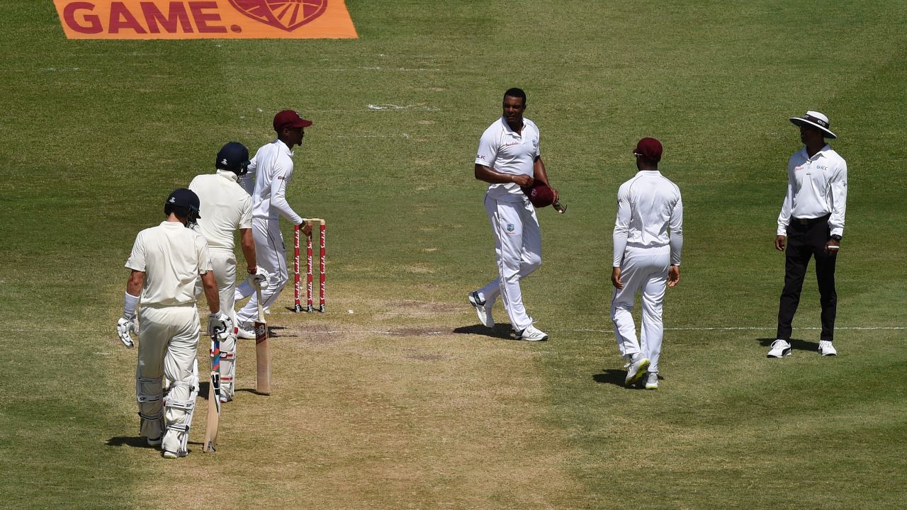 Shannon Gabriel of the West Indies exchanges words with Joe Root and Joe Denly of England.