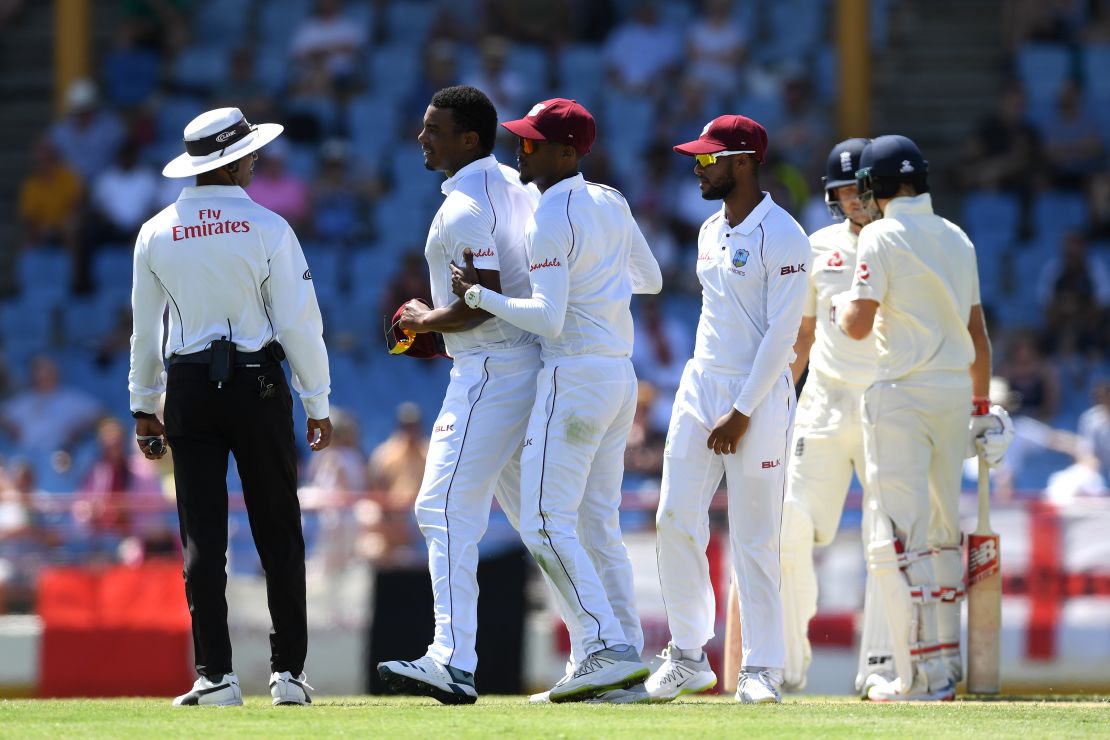 Shannon Gabriel (L) of the West Indies is ushered away by Kraigg Brathwaite of the West Indies after confronting Joe Root and Joe Denly of England.