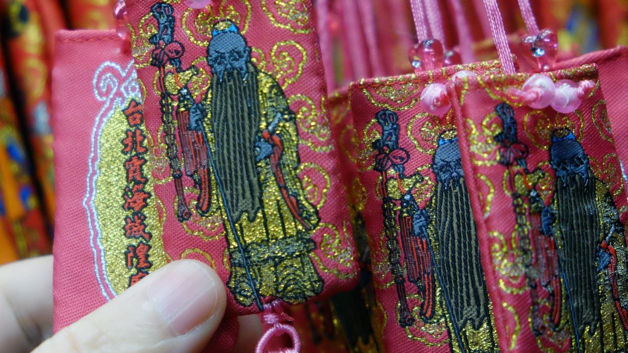 Charms bearing images of the Love God, on sale at the Xia Hai City God Temple.