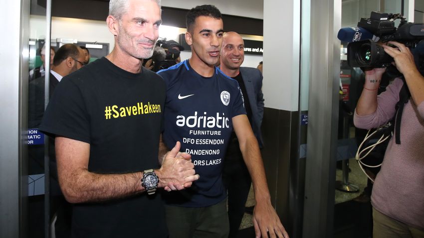 MELBOURNE, AUSTRALIA - FEBRUARY 12: Craig Foster and Hakeem al-Araibi are seen upon al-Araibi's arrival at Melbourne Airport on February 12, 2019 in Melbourne, Australia. Bahraini refugee Hakeem al-Araibi was detained in November when he arrived in Thailand for his honeymoon, spending more than two months in jail while fighting extradition to Bahrain. Al-Araibi fled his home country in 2014 and was granted refugee status in Australia on the grounds he was persecuted and tortured in the Arabian Gulf state for participating in pro-democracy rallies. (Photo by Scott Barbour/Getty Images)