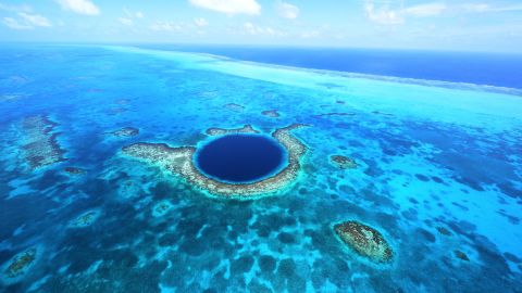 Belize's Great Blue Hole is the largest known sinkhole of its kind. A helicopter tour will show off its full beauty.