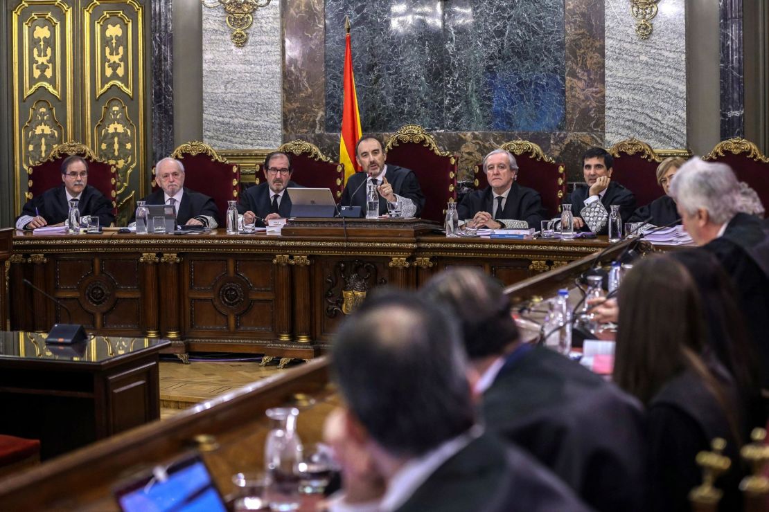 Judge Manuel Marchena (C) speaks next to magistrates during the trial of former Catalan separatist leaders at the Supreme Court in Madrid on February 12.