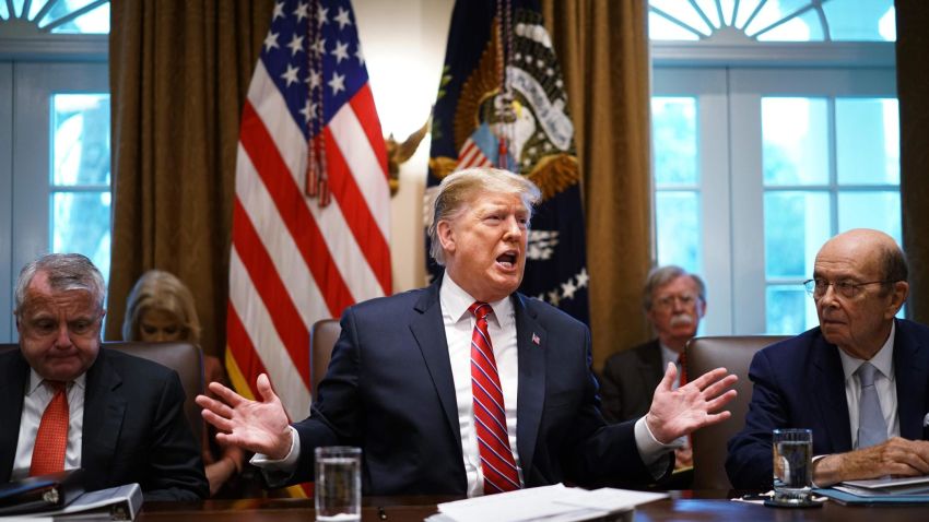 US President Donald Trump speaks during a cabinet meeting in the Cabinet Room of the White House in Washington, DC on February 12, 2019,as Deputy Secretary of State John Sullivan (L) and Commerce Secretary Wilbur Ross(R) look on. - US President Donald Trump said Tuesday he would consider extending the deadline for a trade deal with China beyond March 1. "If we're close to a deal ... I could see myself letting that slide for a little while," Trump said at the White House. (Photo by MANDEL NGAN / AFP)        (Photo credit should read MANDEL NGAN/AFP/Getty Images)