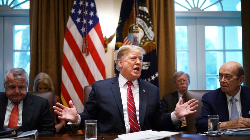 US President Donald Trump speaks during a cabinet meeting in the Cabinet Room of the White House in Washington, DC on February 12, 2019,as Deputy Secretary of State John Sullivan (L) and Commerce Secretary Wilbur Ross(R) look on. - US President Donald Trump said Tuesday he would consider extending the deadline for a trade deal with China beyond March 1. "If we're close to a deal ... I could see myself letting that slide for a little while," Trump said at the White House. (Photo by MANDEL NGAN / AFP) (Photo credit should read MANDEL NGAN/AFP/Getty Images)