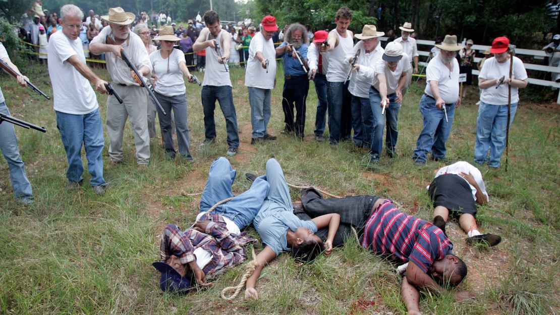 Activists seeking justice for years re-enacted the brutal slayings at the hands of an angry white mob.