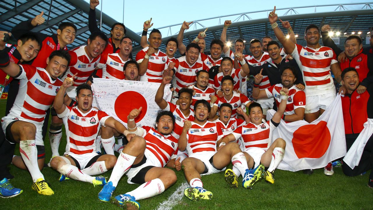 Japanese players celebrate defeating South Africa at the 2015 Rugby World Cup