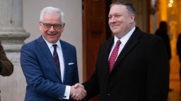 Polish Foreign Minister Jacek Czaputowicz (L) shakes hands with the US Secretary of State Mike Pompeo (R) during the welcome ceremony at the Lazienki Park in Warsaw, Poland on 12 February 2019 (Photo by Mateusz Wlodarczyk/NurPhoto via Getty Images)