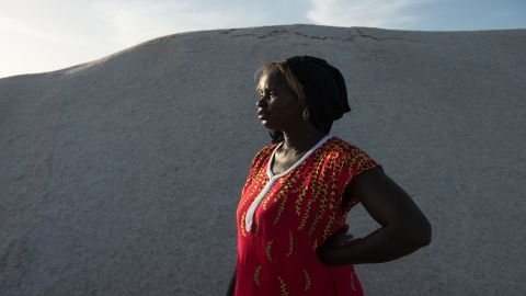 Small-business owner Marie Diouf, known as the "queen of iodized salt," oversees the iodization process at her salt flat in Fatick, Senegal, on December 2, 2018.