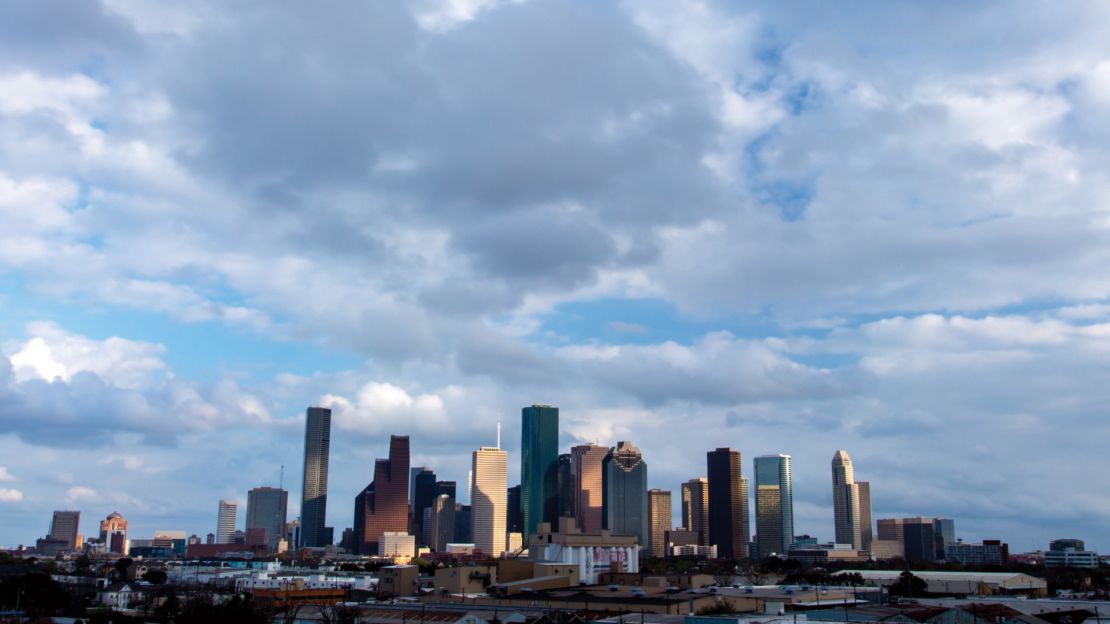 The downtown Houston skyline is dotted with skyscrapers in a variety of architectural styles.
