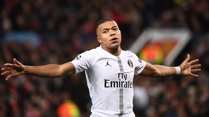 Paris Saint-Germain's French striker Kylian Mbappe celebrates scoring his team's second goal during the first leg of the UEFA Champions League round of 16 football match between Manchester United and Paris Saint-Germain (PSG) at Old Trafford in Manchester, north-west England on February 12, 2019. (Photo by FRANCK FIFE / AFP) (Photo credit should read FRANCK FIFE/AFP/Getty Images)