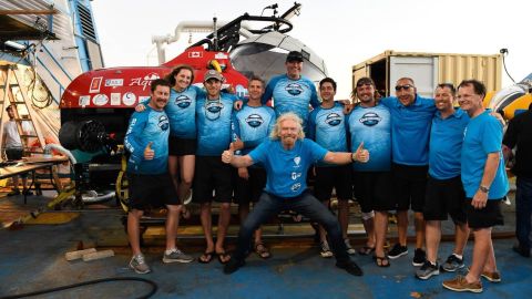 The team, including Sir Richard Branson (center) and chief pilot Erika Bergman (second from left)