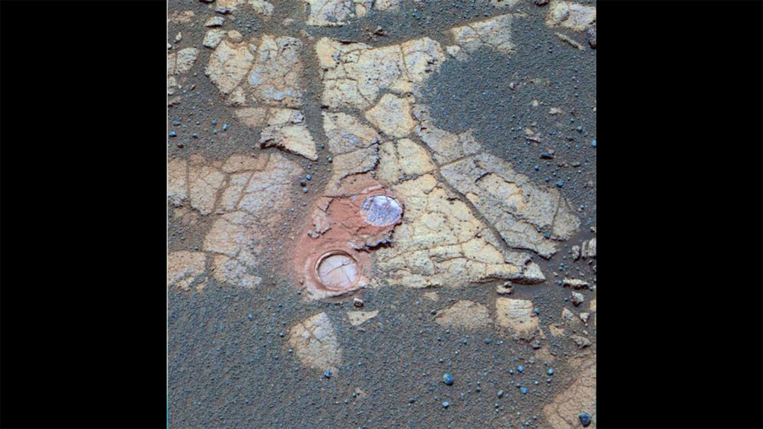 Opportunity's panoramic camera took this photo of outcrop rocks that it encountered on its journey in 2005. Cracks and other features are obvious. The two holes visible were drilled by the rover to expose the underlying material.