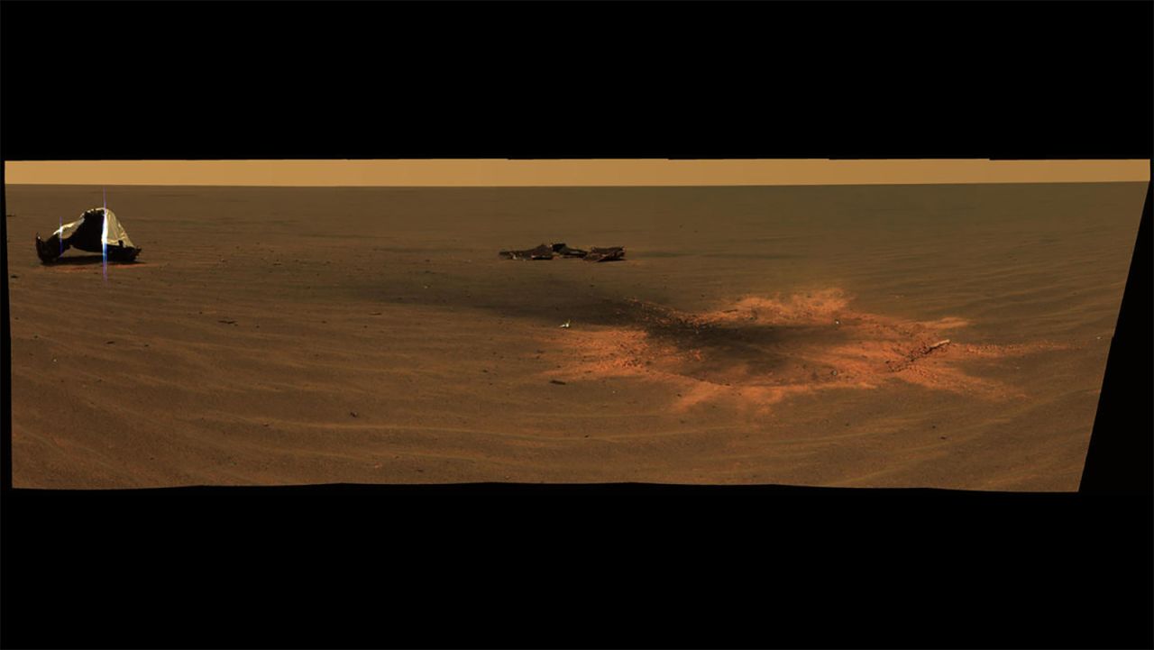 Opportunity made an impact. A panoramic image shows the heat shield impact site when it landed in 2004.