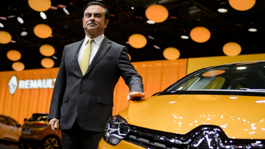 French carmaker Renault CEO Carlos Ghosn poses next to the new Renault Scenic model car at the stand of French carmaker during the press day of the Geneva Motor Show on March 1, 2016 in Geneva. / AFP PHOTO / FABRICE COFFRINI        (Photo credit should read FABRICE COFFRINI/AFP/Getty Images)