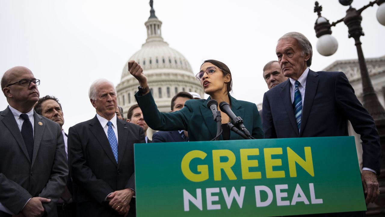 Representative Alexandria Ocasio-Cortez, a Democrat from New York, speaks as Senator Ed Markey, a Democrat from Massachusetts, right, listens during a news conference announcing Green New Deal legislation in Washington, D.C., U.S., on Thursday, Feb. 7, 2019. A sweeping package of climate-change measures unveiled Thursday by Ocasio-Cortez drew a tepid response from House Speaker Nancy Pelosi who didn't explicitly throw her support behind the measure. Photographer: Al Drago/Bloomberg via Getty Images