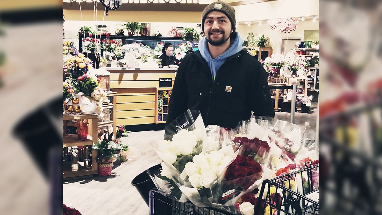 Seth Stewart's cart is loaded with 300 roses to deliver on Valentine's Day, and he will have to go back for more. 