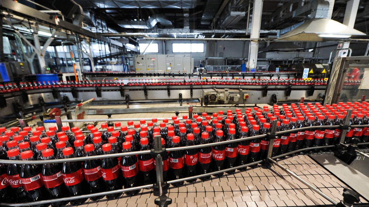 Coca-Cola said costs from refranchising its bottling system contributed to a dip in revenue last year. 